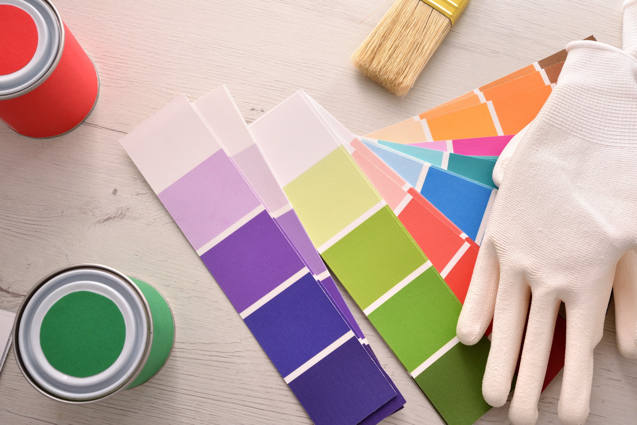 Tools for painting houses on wooden white table